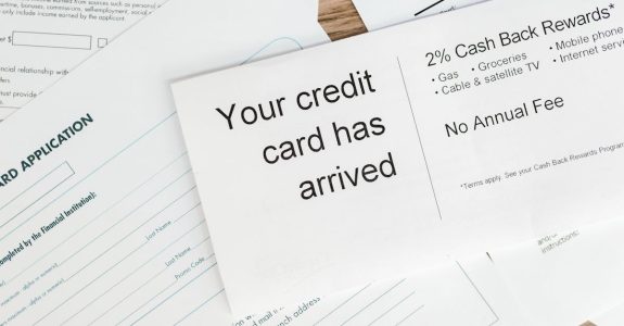close-up-of-a-letter-announcing-the-arrival-of-a-credit-card-amidst-financial-documents-1