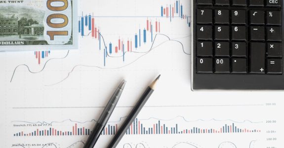 stock-analysis-workspace-featuring-charts-a-calculator-and-currency-for-data-driven-insights-1